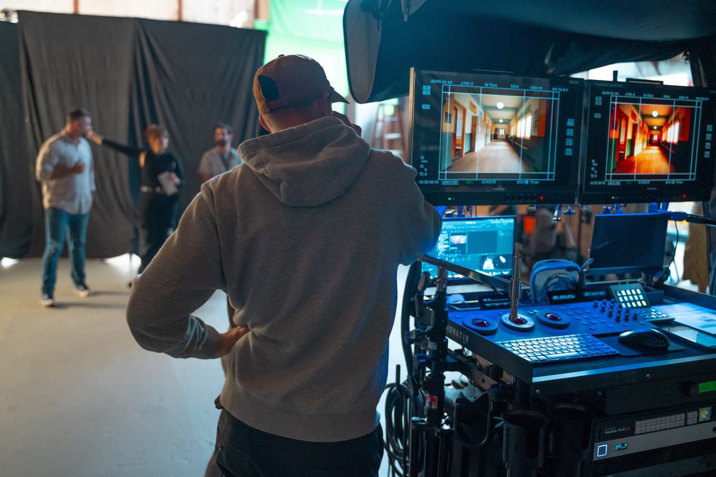 Two monitors showing a corridor setup while the shot is checked