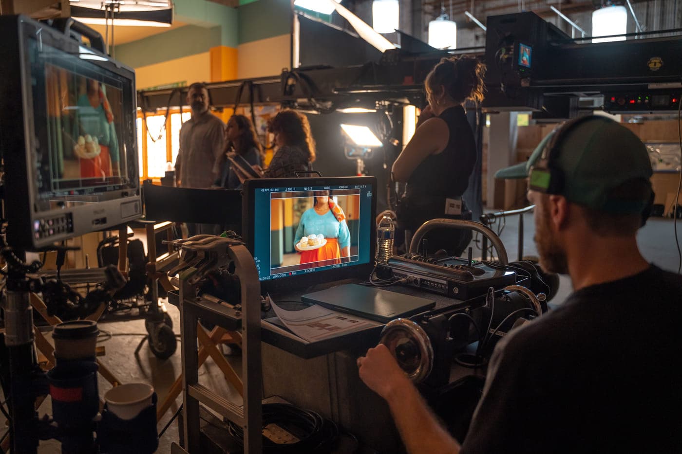 A monitor at video village showing the framed shot as it is being recorded